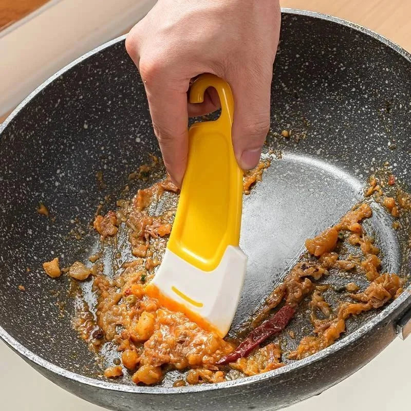 Espátula de silicona para limpieza de utensilios de cocina.